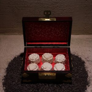 Coffret of Service no. 1 (2025) - 6 mycelium-cast moon cakes in an antique rosewood box (south-east Asia). Image courtesy of Kay Murata